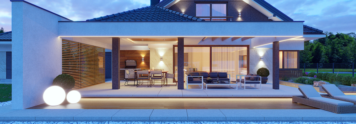 Nowoczesna elewacja budynku jednorodzinnego widok od strony tarasu. Widok w nocy.